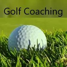 A golf ball in the grass with words " golf coaching ".