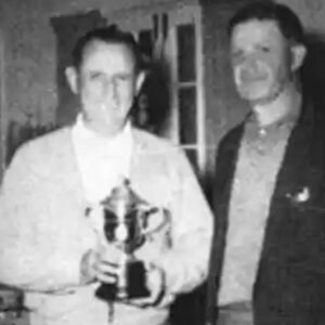 Two men standing next to each other holding a trophy.